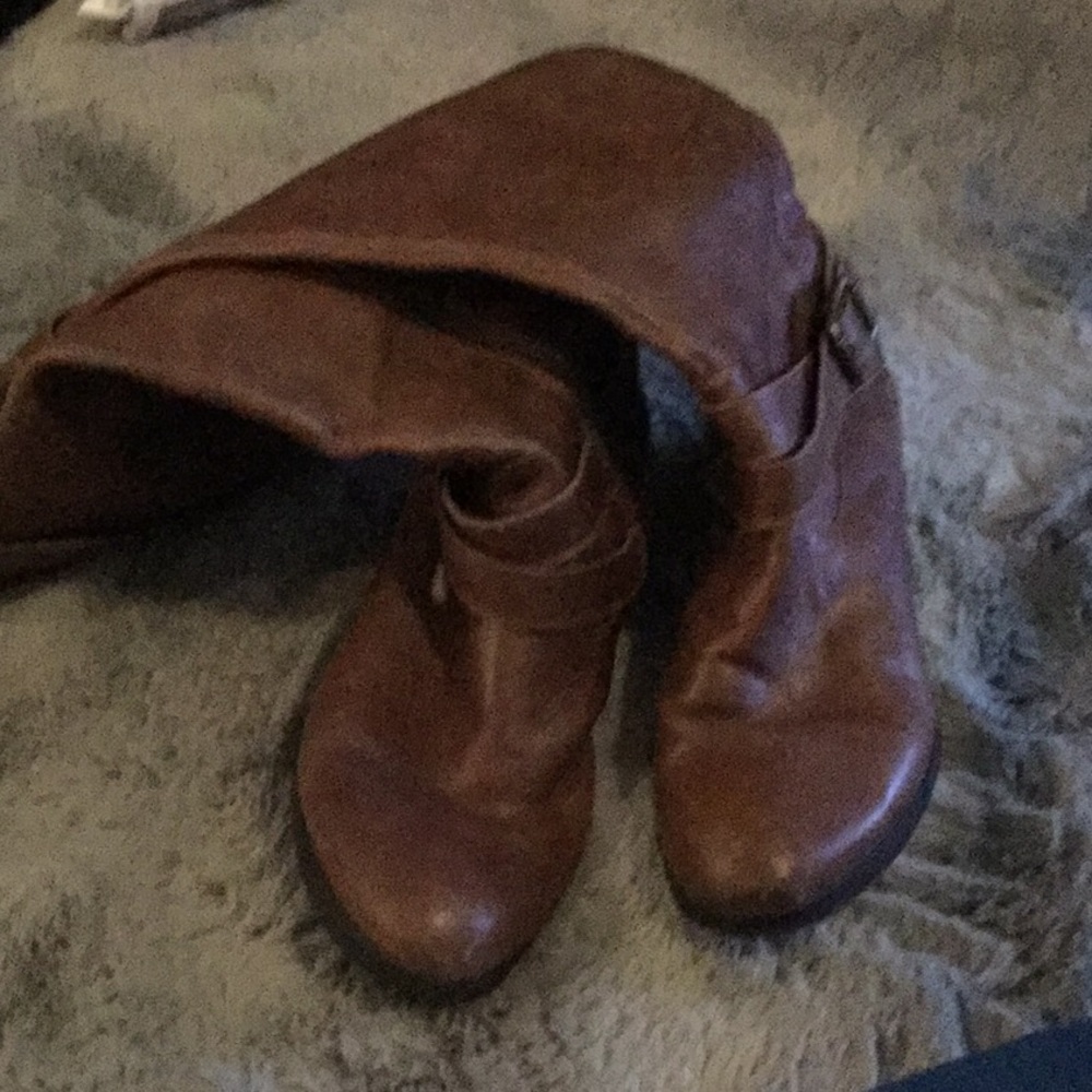 Tall distressed brown boots